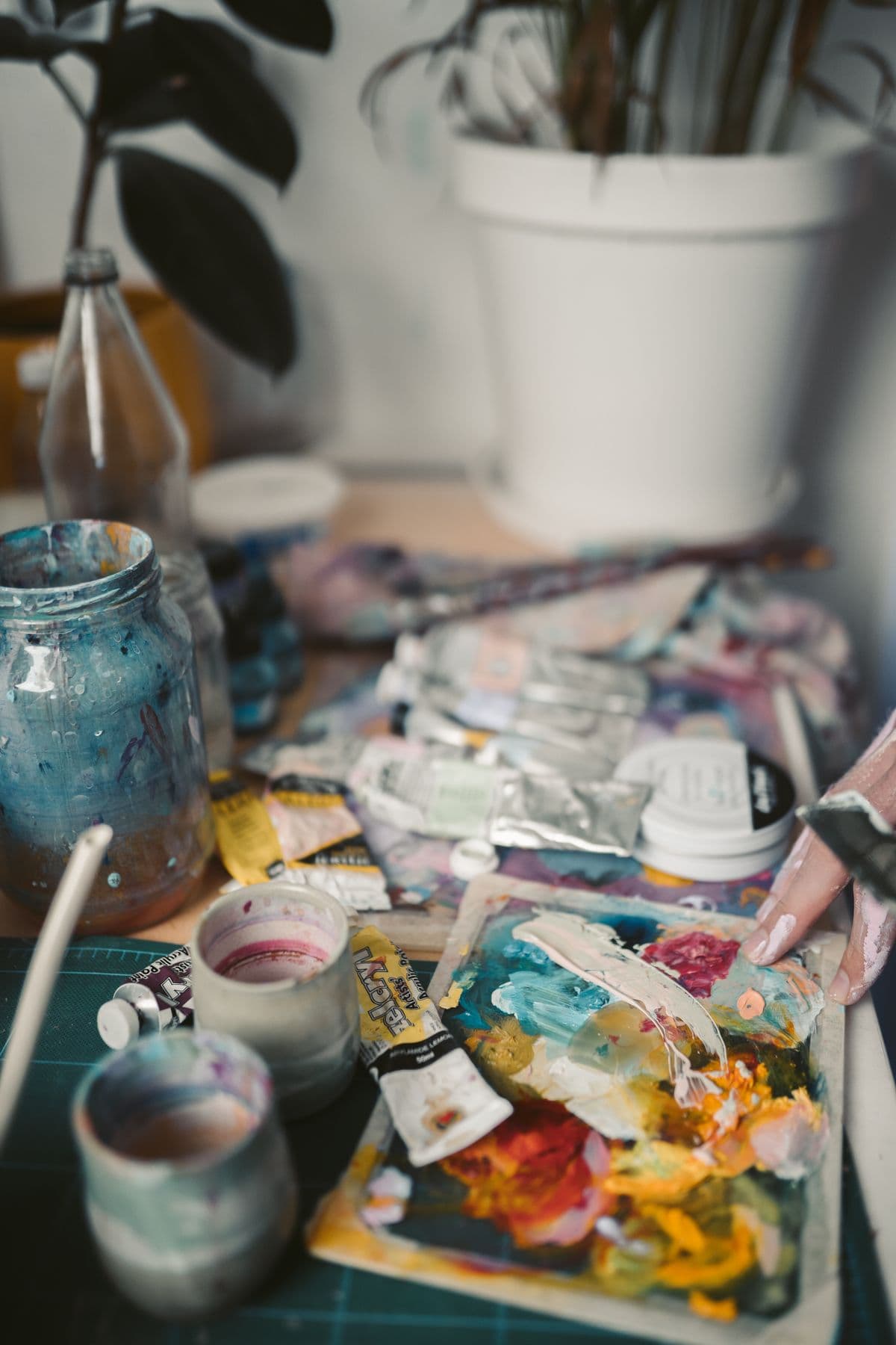 Illustrative stock photo of paint tubes, brushes, and a palette
