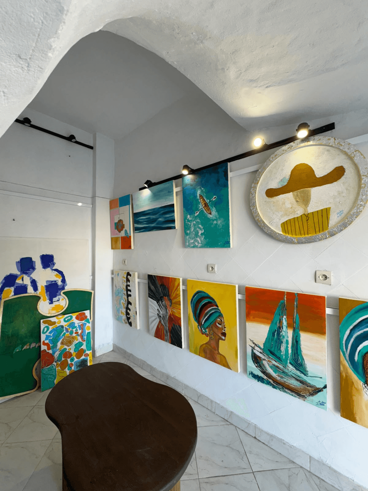 Another view of the Essaouira studio and its displayed paintings